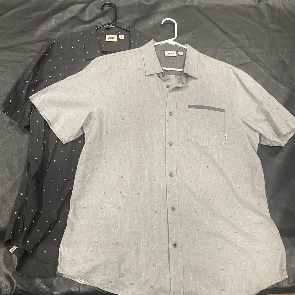 Men’s short sleeve vans button ups.  In good condition.  One grey and one black